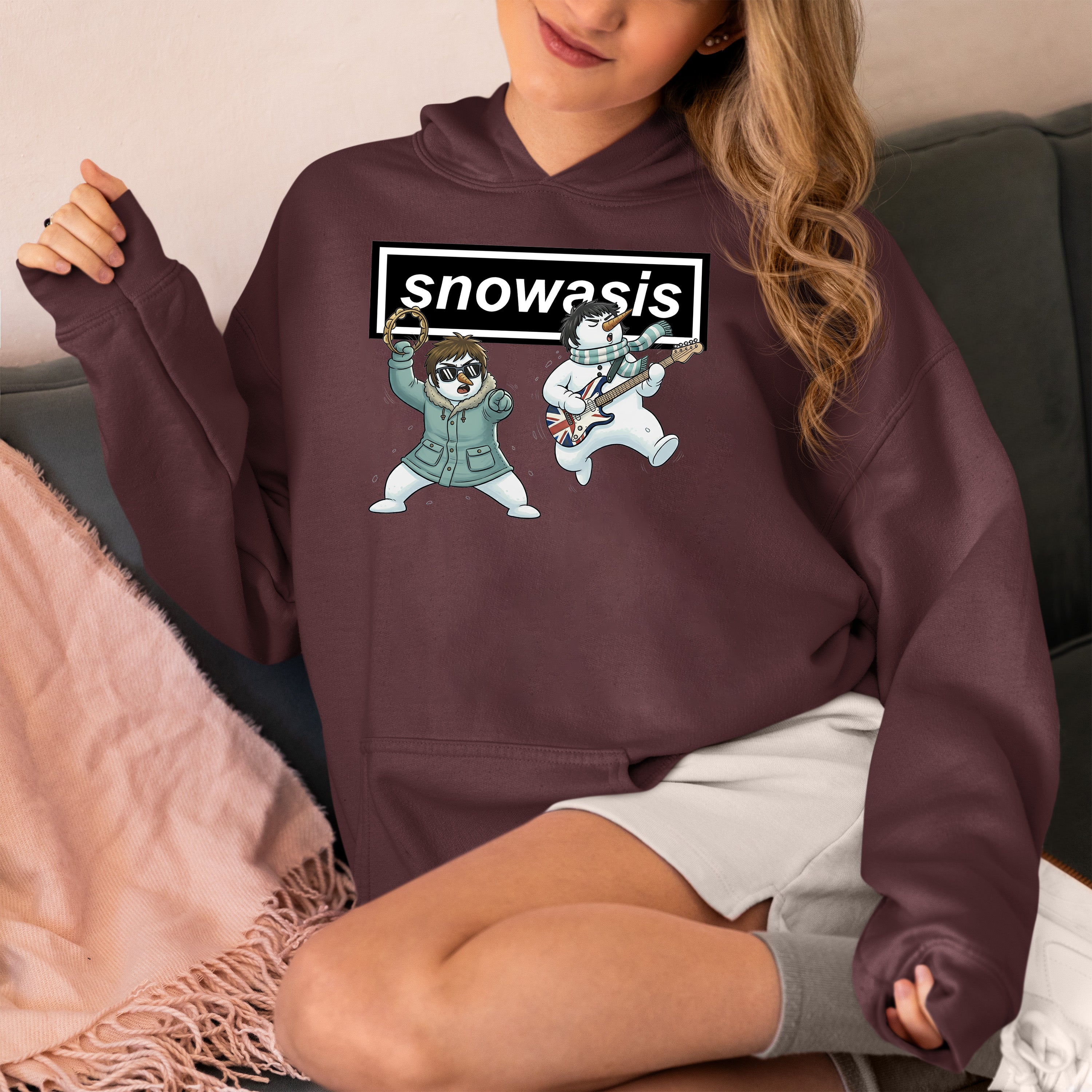 Christmas Snowasis rocking on a snowy hillside, cozy festive scene for holidays, Snowasis rocking on Hoodie