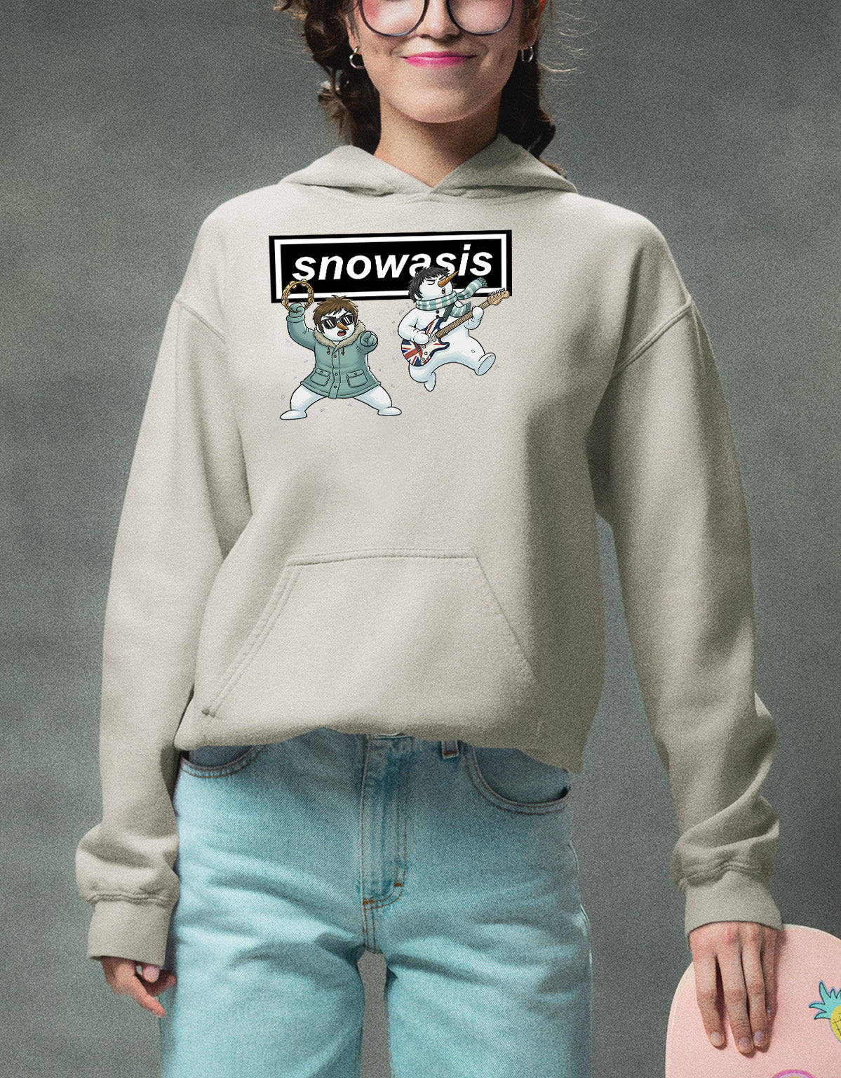 Christmas Snowasis rocking on a snowy hillside, cozy festive scene for holidays, Snowasis rocking on Hoodie