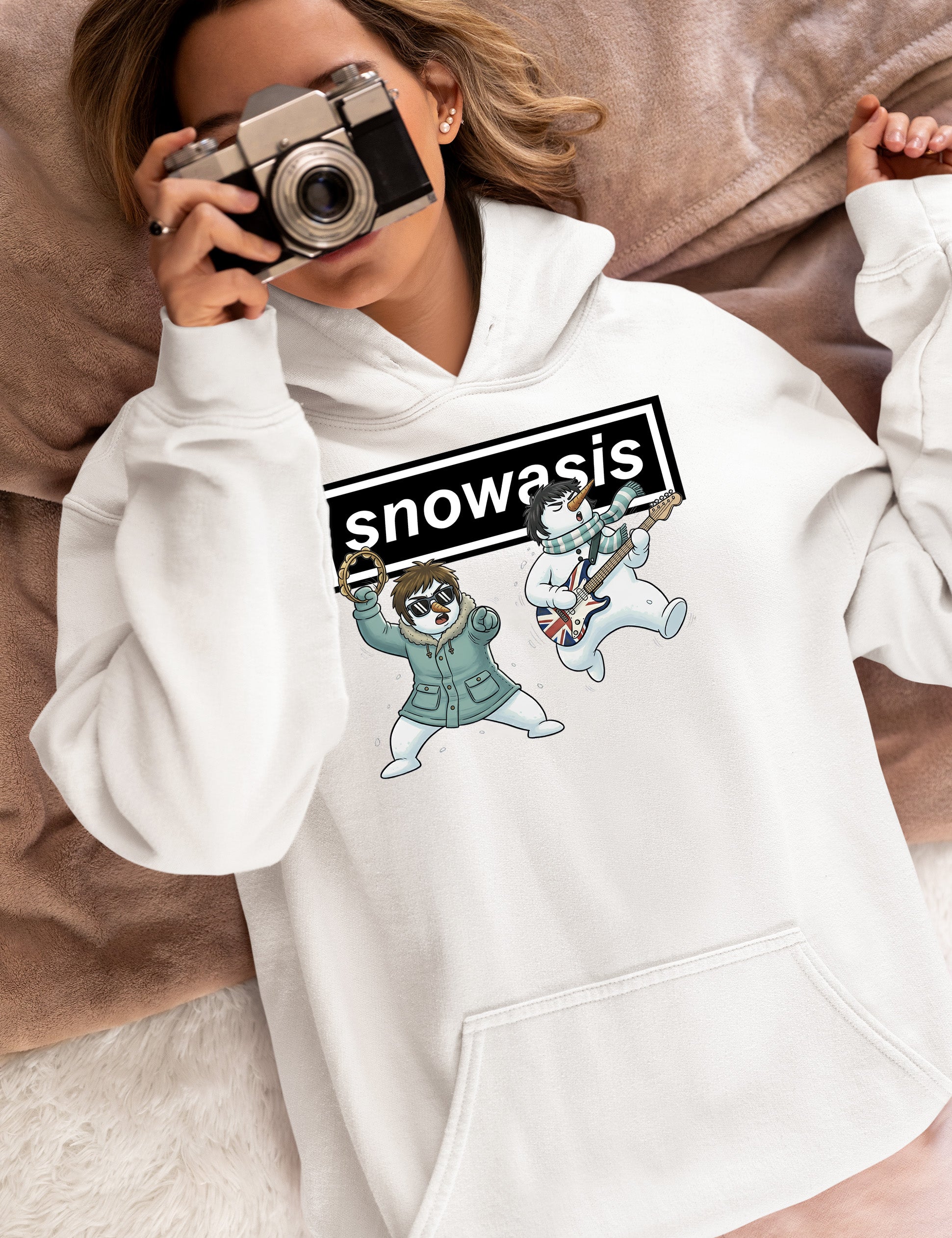 Christmas Snowasis rocking on a snowy hillside, cozy festive scene for holidays, Snowasis rocking on Hoodie